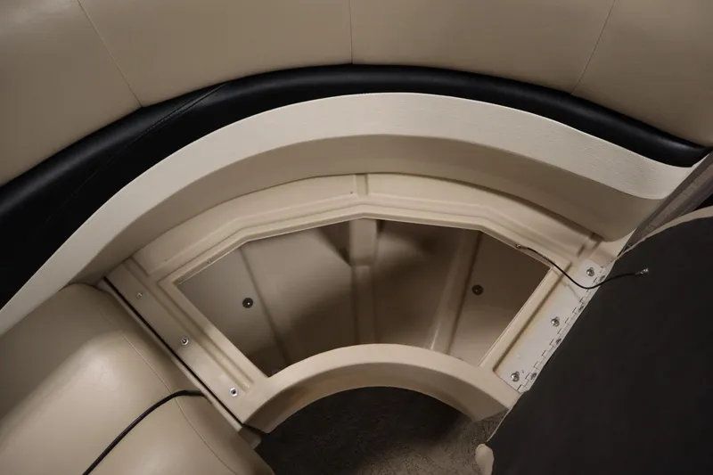 Slide: The Image of 2013 Harris Cruiser 220 boat interior seating with storage compartment. - 14