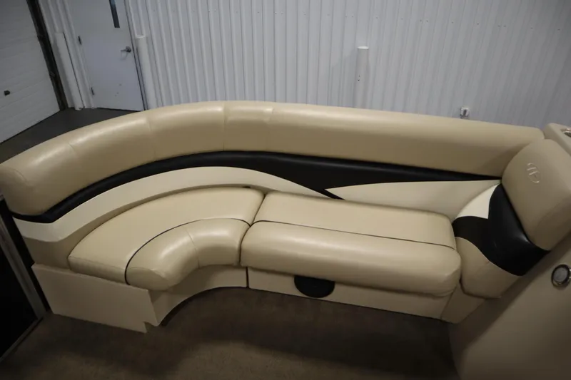 Slide: The Image of 2013 Harris Cruiser 220 boat interior with beige and black seating. - 15