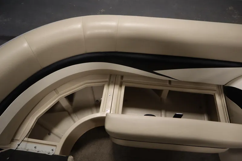 Slide: The Image of 2013 Harris Cruiser 220 boat interior seating with storage compartment. - 16