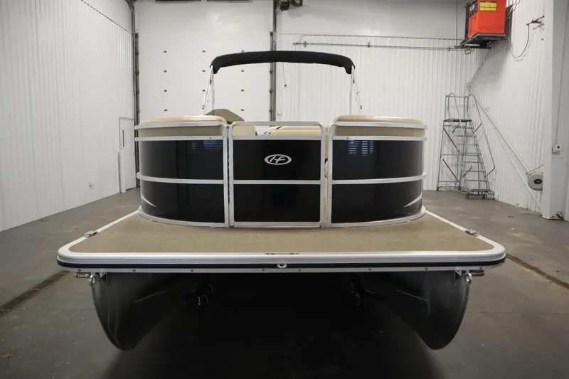 Slide: The Image of 2013 Harris Cruiser 220 pontoon boat in indoor storage facility. - 2