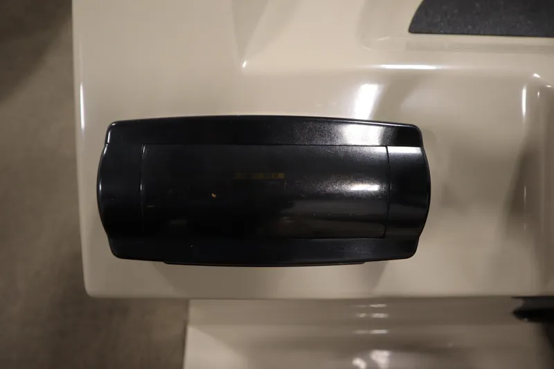 Slide: The Image of Control panel of a 2013 Harris Cruiser 220 boat, featuring a sleek black design. - 24