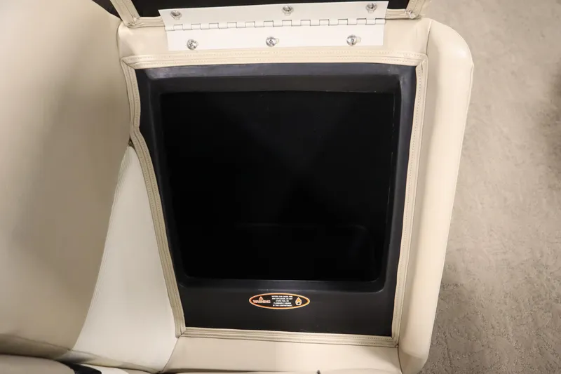 Slide: The Image of Open storage compartment in 2013 Harris Cruiser 220 boat seat. - 29