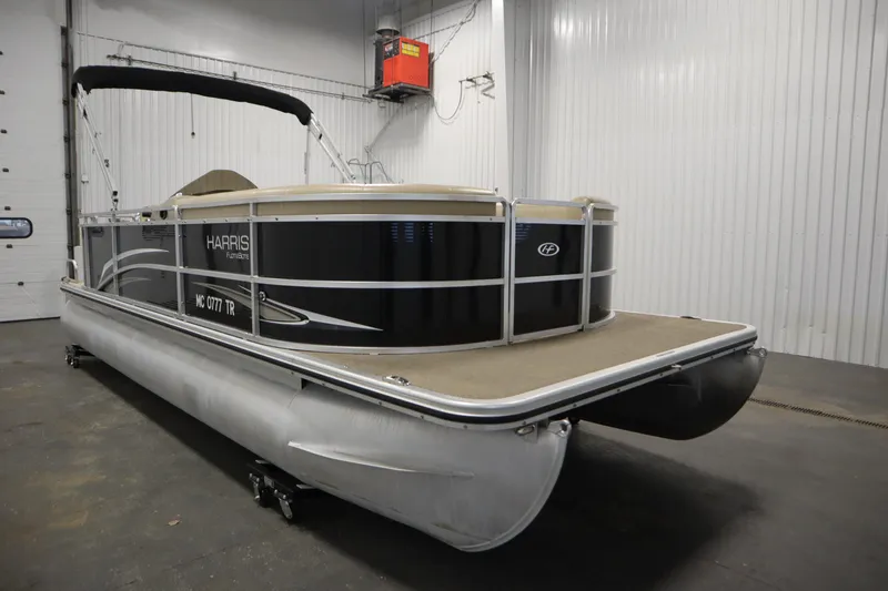 Slide: The Image of 2013 Harris Cruiser 220 pontoon boat in indoor storage facility. - 3