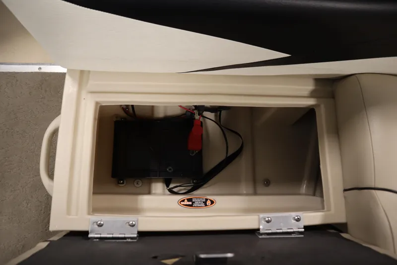 Slide: The Image of Battery compartment of a 2013 Harris Cruiser 220 boat, featuring secure wiring. - 31