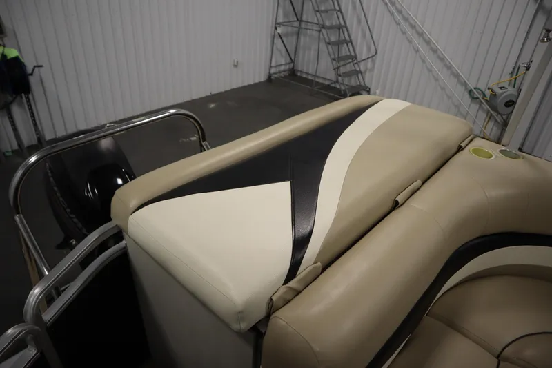 Slide: The Image of 2013 Harris Cruiser 220 boat interior with beige and black seating. - 33