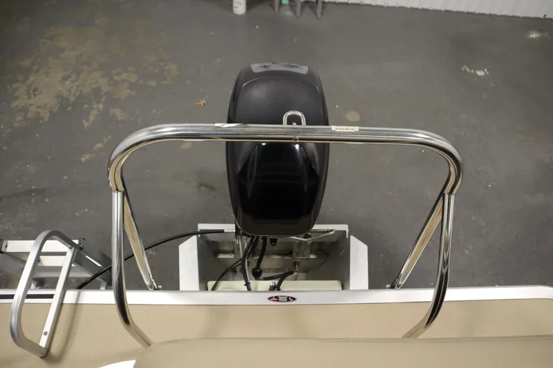 Slide: The Image of 2013 Harris Cruiser 220 boat engine and railing, viewed from above. - 34