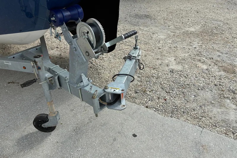 Slide: The Image of Trailer hitch of 2023 Bayliner Element 180 XL boat on gravel surface. - 17