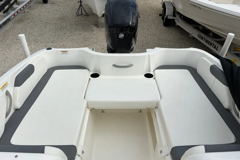 Slide: The Image of 2023 Bayliner Element 180 XL boat interior with white and gray seating. - 9