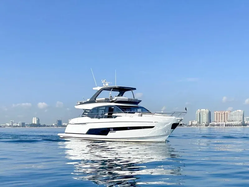 Slide: The Image of 2024 Fairline Squadron 68 luxury yacht on calm waters. - 1
