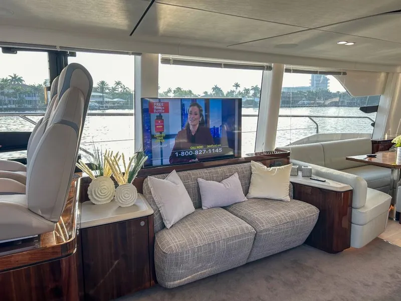 Slide: The Image of Luxurious interior of 2024 Fairline Squadron 68 yacht with modern furnishings and waterfront view. - 15
