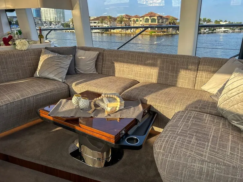 Slide: The Image of Luxurious interior of 2024 Fairline Squadron 68 yacht with waterfront view. - 16
