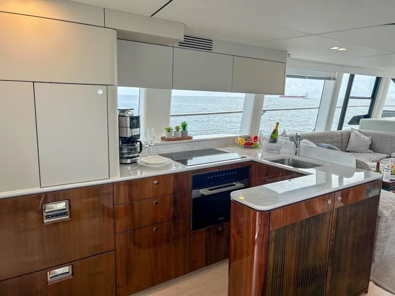 Slide: The Image of Modern kitchen interior on 2024 Fairline Squadron 68 yacht with ocean view. - 17