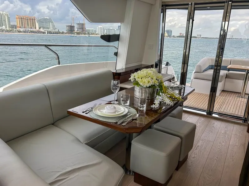 Slide: The Image of Luxurious dining area on the 2024 Fairline Squadron 68 yacht with ocean view. - 19