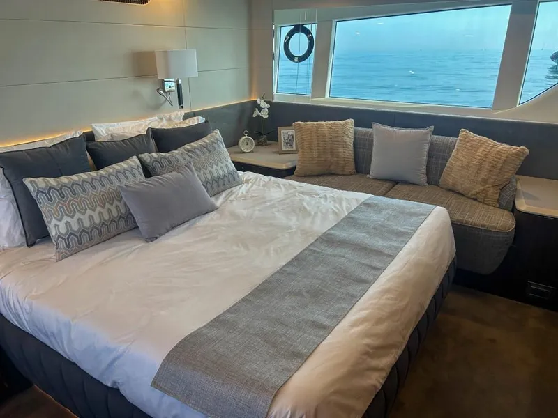 Slide: The Image of Luxurious bedroom in 2024 Fairline Squadron 68 yacht with ocean view. - 22