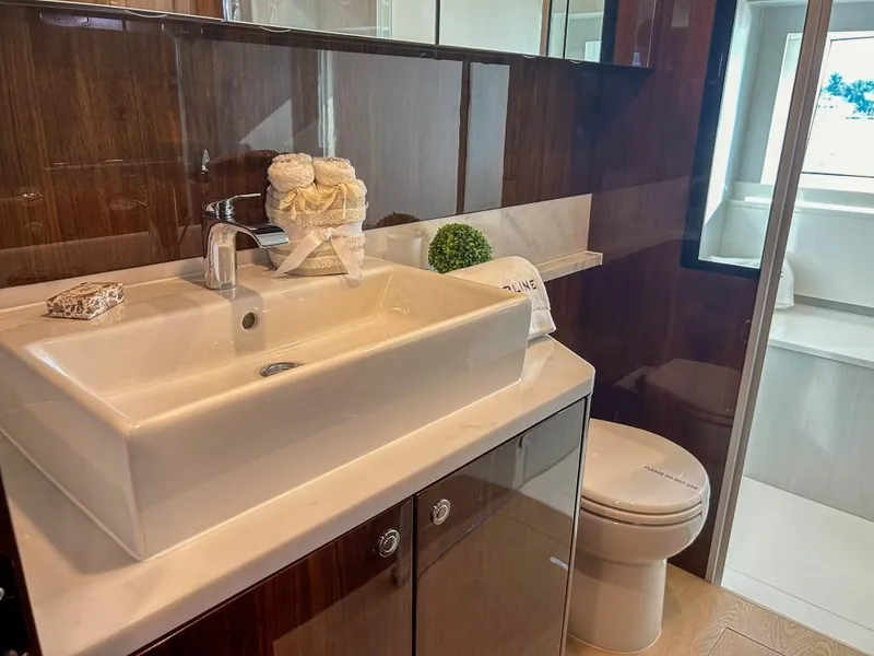 Slide: The Image of Luxury bathroom in the 2024 Fairline Squadron 68 yacht with modern fixtures. - 26