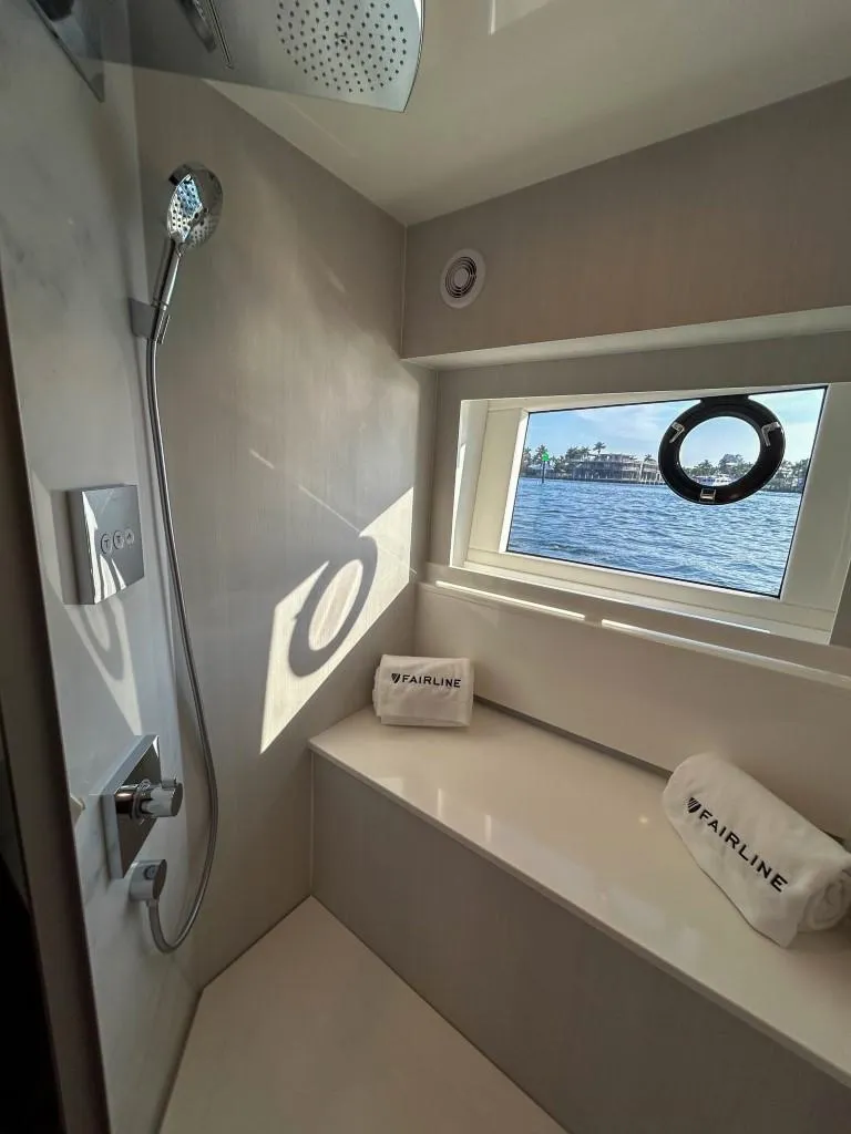 Slide: The Image of Luxury bathroom in 2024 Fairline Squadron 68 yacht with a scenic window view. - 27