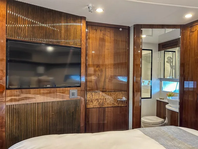 Slide: The Image of Luxurious interior of 2024 Fairline Squadron 68 yacht with TV and ensuite bathroom. - 29