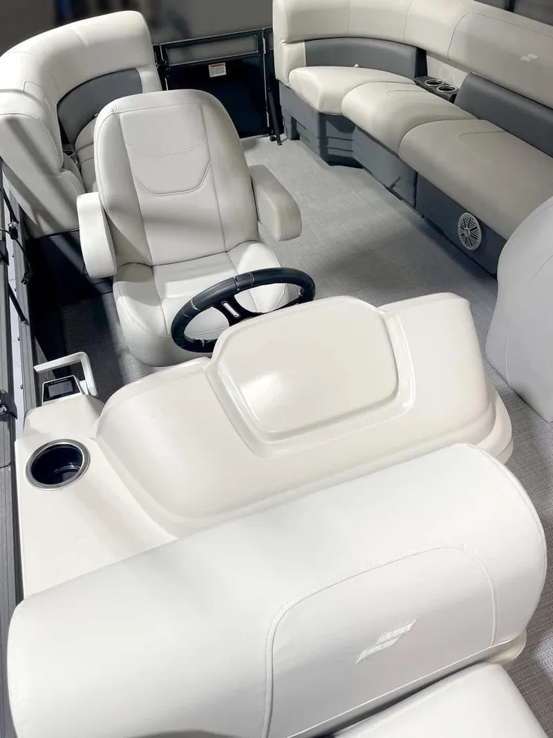 Slide: The Image of 2024 Vision Marine Technologies WX Tritoon interior with plush seating and modern steering console. - 2