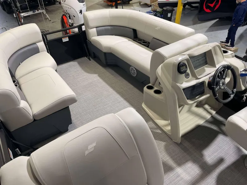 Slide: The Image of 2024 Vision Marine Technologies WX Tritoon interior with plush seating and modern dashboard. - 3