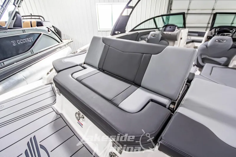 Slide: The Image of 2026 Chaparral 23 SSi boat interior with sleek gray seating and modern design. - 10