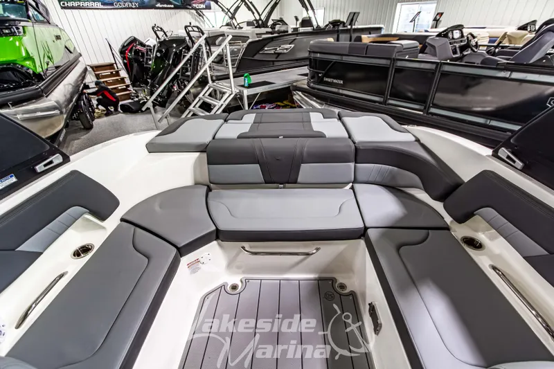 Slide: The Image of 2026 Chaparral 23 SSi boat interior with gray seating at Lakeside Marina showroom. - 12