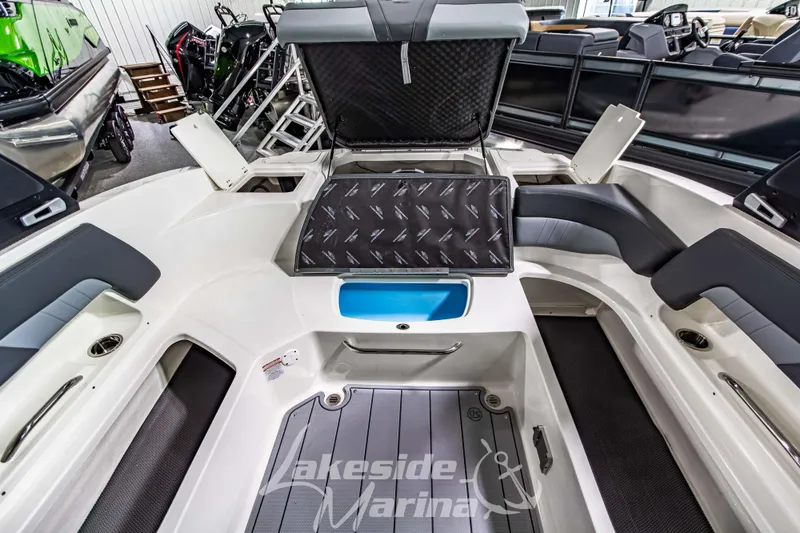 Slide: The Image of 2026 Chaparral 23 SSi boat interior with seating and storage compartments at Lakeside Marina. - 13