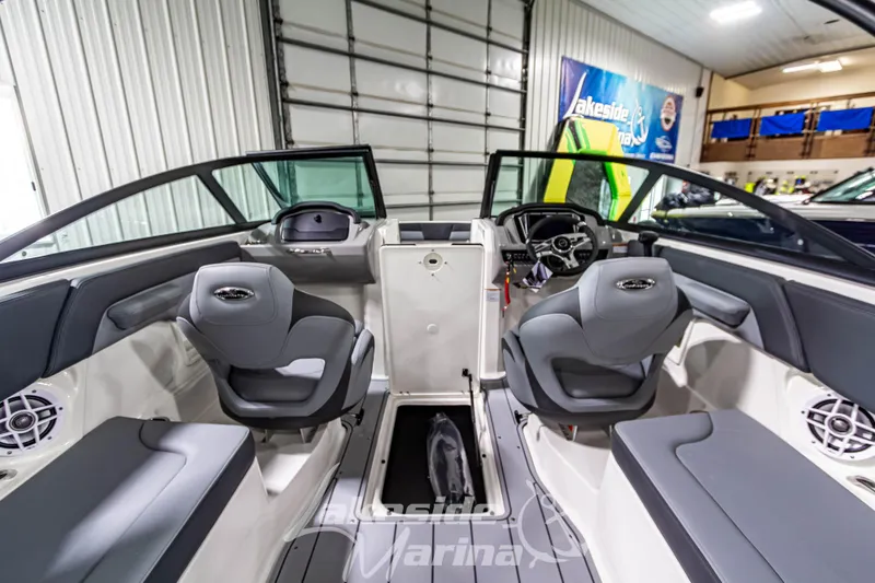 Slide: The Image of 2026 Chaparral 23 SSi boat interior with modern seating and dashboard design. - 17