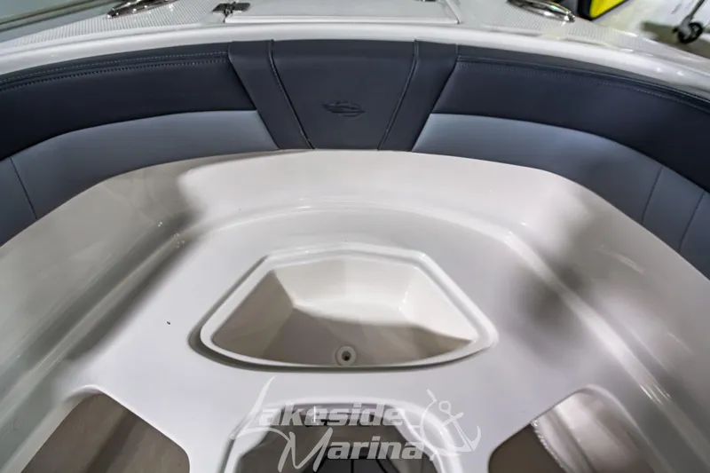 Slide: The Image of 2026 Chaparral 23 SSi boat interior with sleek seating and storage compartment. - 30