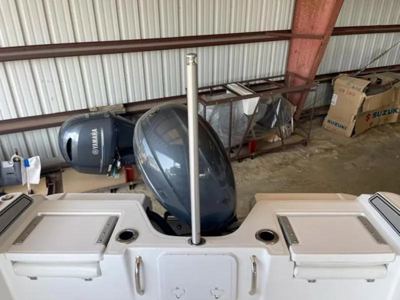 Slide: The Image of 2024 Wellcraft 202 Fisherman boat with Yamaha outboard motor in storage. - 11