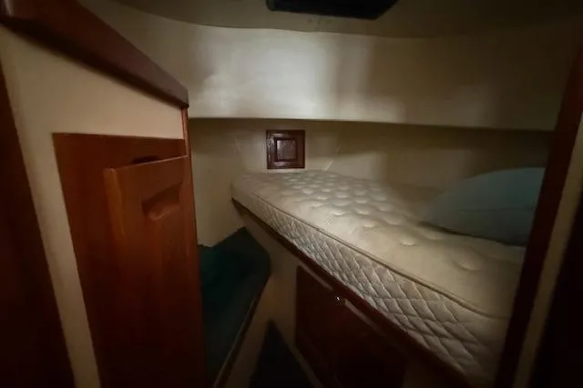 Slide: The Image of Cozy cabin interior of a 1996 Nordic Tug 26 with a comfortable mattress. - 11