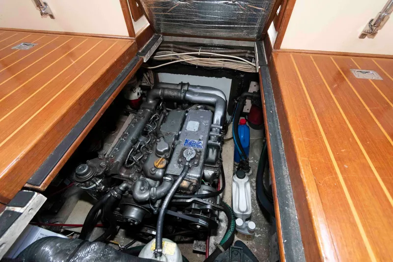 Slide: The Image of Engine compartment of a 1996 Nordic Tug 26, showcasing detailed mechanical components. - 21