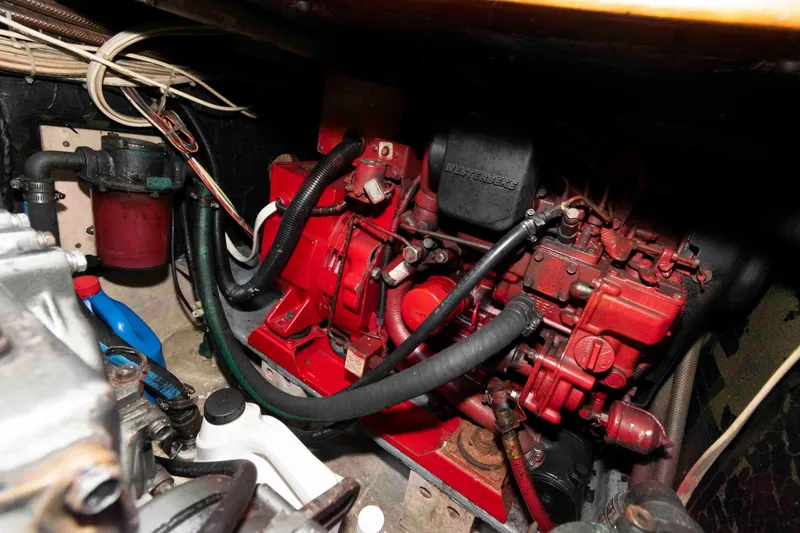 Slide: The Image of Engine compartment of a 1996 Nordic Tug 26, featuring a red Westerbeke engine. - 22