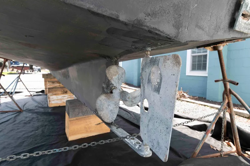 Slide: The Image of 1996 Nordic Tug 26 boat propeller and rudder on dry dock. - 23