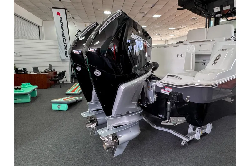 Slide: The Image of 2024 Wellcraft 263 Fisherman boat with dual Mercury outboard engines in showroom. - 4