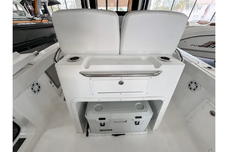 Slide: The Image of 2024 Wellcraft 263 Fisherman boat interior with seating and storage area. - 8