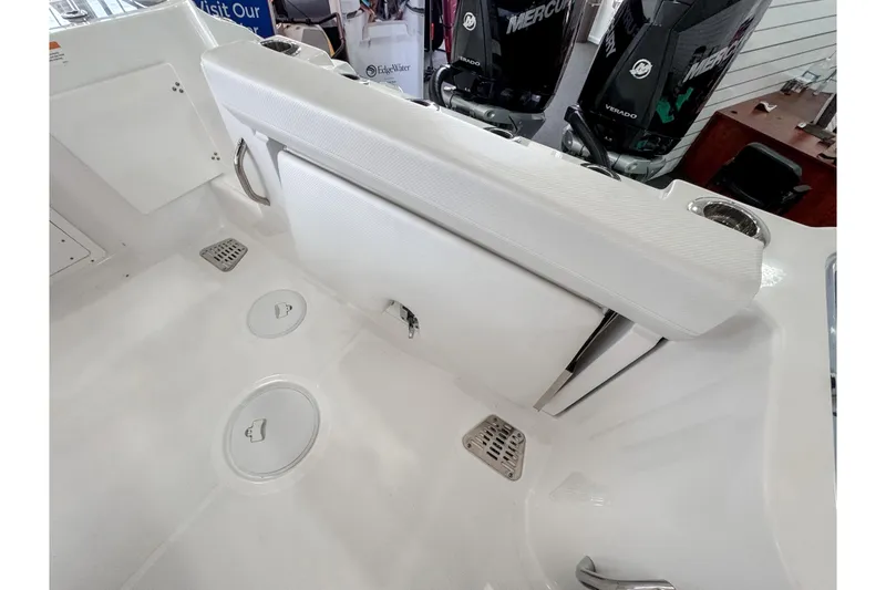Slide: The Image of 2024 Wellcraft 263 Fisherman boat interior with seating and storage compartments. - 6