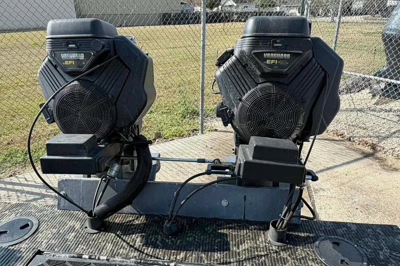 Slide: The Image of Dual Vanguard EFI engines on a 2015 Custom 2175 Bowfishing boat. - 10