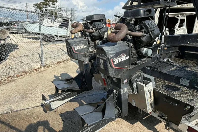 Slide: The Image of Custom 2015 2175 Bowfishing boat with dual Gator Tail outboard motors in a marina setting. - 11