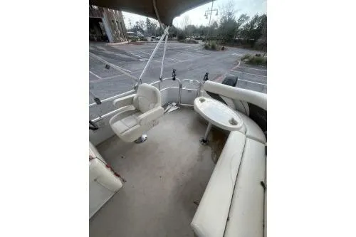 Slide: The Image of 2016 SunChaser Oasis 820 FNC boat interior with seating and table. - 11