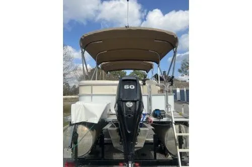 Slide: The Image of 2016 SunChaser Oasis 820 FNC pontoon boat with canopy and 60 HP outboard motor. - 4
