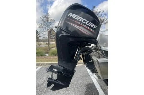 Slide: The Image of 2016 SunChaser Oasis 820 FNC with Mercury outboard motor in parking lot. - 5