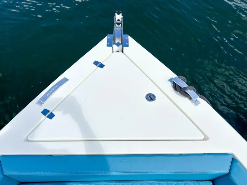 Slide: The Image of Bow of 2023 De Antonio Yachts D28 Open on water, featuring sleek design and blue accents. - 21