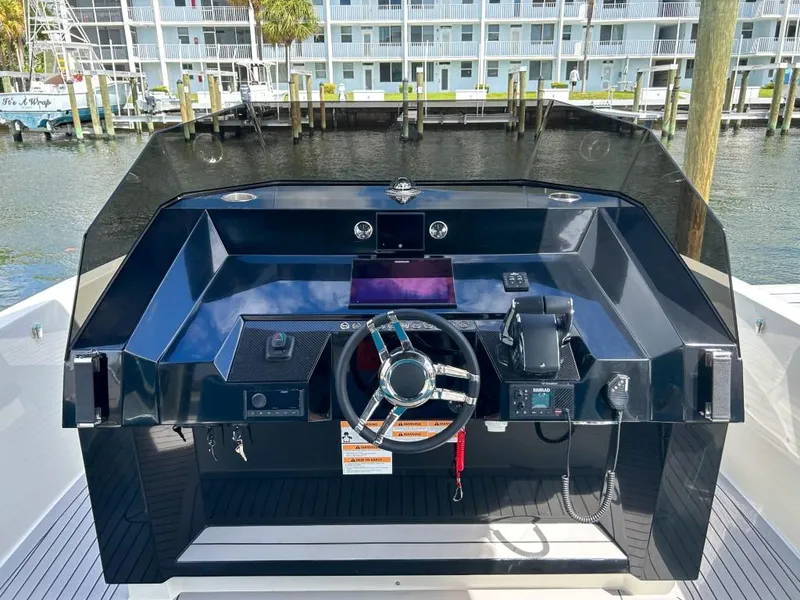 Slide: The Image of 2023 De Antonio Yachts D28 Open helm with modern controls and sleek design. - 9