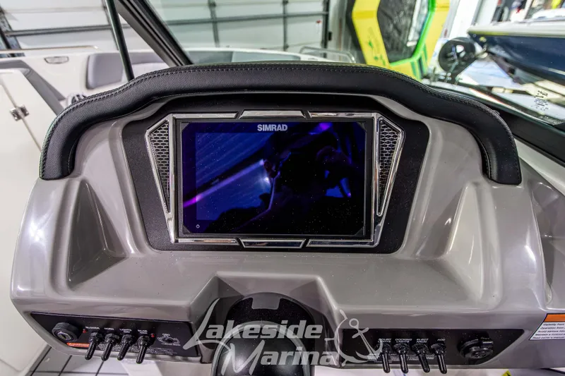 Slide: The Image of Dashboard of 2026 Chaparral 23 SSi boat with Simrad display at Lakeside Marina. - 18