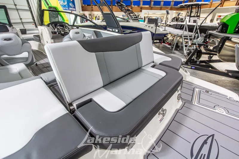 Slide: The Image of 2026 Chaparral 23 SSi boat interior with gray seating and modern design. - 8
