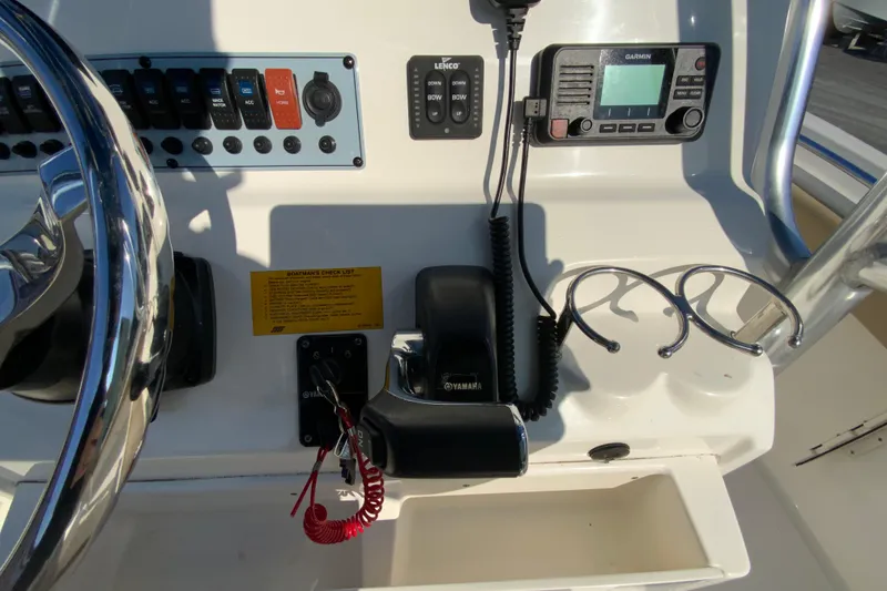 Slide: The Image of 2019 Key West 239 FS boat dashboard with controls and Garmin device. - 14