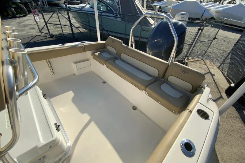 Slide: The Image of 2019 Key West 239 FS boat interior with seating and rod holders. - 15