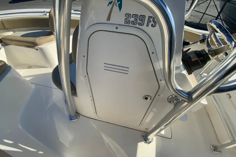 Slide: The Image of 2019 Key West 239 FS boat console with seating and steering wheel. - 30