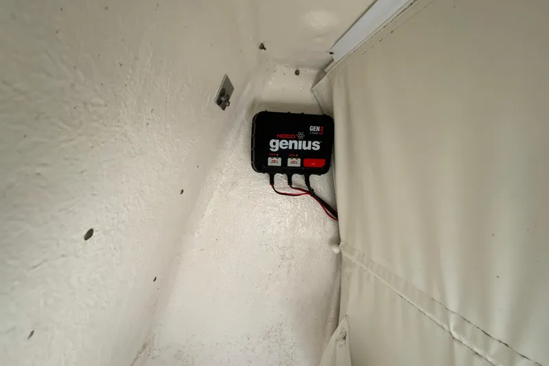 Slide: The Image of NOCO Genius GEN2 battery charger installed in 2019 Key West 239 FS boat compartment. - 32