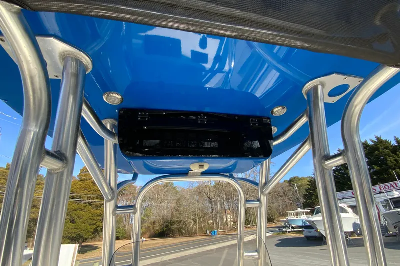Slide: The Image of 2019 Key West 239 FS boat with blue T-top and stainless steel frame. - 33